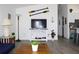 Cozy living area with a mounted TV, modern decor, and views into the kitchen at 3315 W Saint John St, Tampa, FL 33607