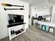 Open-concept living area with a modern kitchen featuring stainless steel appliances and breakfast bar seating at 3315 W Saint John St, Tampa, FL 33607