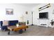 Inviting living room showcasing modern decor, a mounted TV, and stylish furniture at 3315 W Saint John St, Tampa, FL 33607