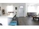 Bright, open living room featuring modern gray floors, white walls, and a stylish seating area at 3315 W Saint John St, Tampa, FL 33607