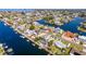 A picturesque aerial view of waterfront homes with private docks on canals leading to open water at 3352 Gulfview Dr, Hernando Beach, FL 34607