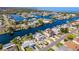 Aerial view of a waterfront community with multiple canals, and neatly landscaped homes at 3352 Gulfview Dr, Hernando Beach, FL 34607