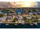 Aerial view of a waterfront home with a backyard pool and dock, showcasing access to Gulf waters at 3352 Gulfview Dr, Hernando Beach, FL 34607