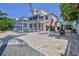 Expansive backyard with pavers, leading to pool area, perfect for outdoor relaxation and entertaining at 3352 Gulfview Dr, Hernando Beach, FL 34607