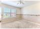 Cozy bedroom with plush carpeting, base trim, and large window at 3352 Gulfview Dr, Hernando Beach, FL 34607