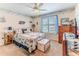 Cozy bedroom with coastal decor, ceiling fan, and natural light at 3352 Gulfview Dr, Hernando Beach, FL 34607
