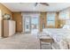 Spacious bedroom with private balcony, carpeted floor, and neutral walls at 3352 Gulfview Dr, Hernando Beach, FL 34607