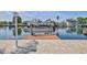 View of a pontoon boat on a boat lift on a waterway at 3352 Gulfview Dr, Hernando Beach, FL 34607