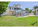 Beautiful multi-story home featuring a screened-in lanai and pool, surrounded by a lush lawn at 3352 Gulfview Dr, Hernando Beach, FL 34607