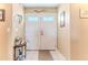 Inviting front entrance with double doors, tile flooring, and decorative accents creating a welcoming space at 3352 Gulfview Dr, Hernando Beach, FL 34607