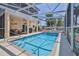 Beautiful screened-in pool with outdoor dining area, creating a perfect backyard oasis at 3352 Gulfview Dr, Hernando Beach, FL 34607