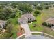 Lovely single-story home featuring a brick driveway, screened-in pool, and a well-manicured lawn in a serene setting at 3400 Rosebay Ct, Spring Hill, FL 34609