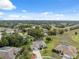 High angle view featuring community featuring mature trees, spacious yards, and tree lined streets at 3400 Rosebay Ct, Spring Hill, FL 34609