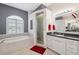 Bright bathroom with a soaking tub, glass enclosed shower, and double vanity at 3400 Rosebay Ct, Spring Hill, FL 34609