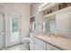 Bathroom featuring a large vanity and a glass-enclosed shower at 3400 Rosebay Ct, Spring Hill, FL 34609