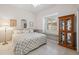 Bedroom with a display cabinet and a window seat beneath plantation shutters at 3400 Rosebay Ct, Spring Hill, FL 34609