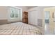 Bedroom showcasing a display cabinet and a window seat beneath plantation shutters at 3400 Rosebay Ct, Spring Hill, FL 34609