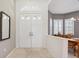 Welcoming foyer with a double-door entrance and view into the dining area at 3400 Rosebay Ct, Spring Hill, FL 34609