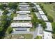 Bird's-eye view of condo community with mature landscaping and convenient carport parking at 3544 Teeside Dr # 1, New Port Richey, FL 34655