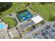 Aerial image featuring tennis courts, parking, and clubhouse facilities within the community at 3544 Teeside Dr # 1, New Port Richey, FL 34655