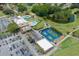 Community aerial view with a clubhouse, pool, tennis courts, and beautiful landscaping at 3544 Teeside Dr # 1, New Port Richey, FL 34655