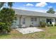 Backyard featuring a small patio with a table and chairs and green grass at 3544 Teeside Dr # 1, New Port Richey, FL 34655