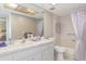 Bright bathroom with a large mirror, vanity with sink, and a shower/tub combo with a curtain at 3544 Teeside Dr # 1, New Port Richey, FL 34655