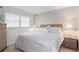 Bedroom featuring a neatly made bed with white linens and matching bedside tables at 3544 Teeside Dr # 1, New Port Richey, FL 34655