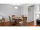 Dining area with round table and wood floors adjacent to the kitchen at 3544 Teeside Dr # 1, New Port Richey, FL 34655