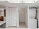 Hallway near kitchen with laundry units and closet at 3544 Teeside Dr # 1, New Port Richey, FL 34655