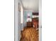 Entry view of a primary bedroom with beautiful hardwood flooring and wooden furniture at 3544 Teeside Dr # 1, New Port Richey, FL 34655