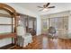 Bright sunroom with wood floors and a sliding glass door leading outside at 3544 Teeside Dr # 1, New Port Richey, FL 34655