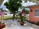 Charming home with a well-maintained front yard, nice landscaping, and a visible American flag at 406 Driftwood E Dr, Palm Harbor, FL 34683