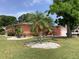 Enjoy this beautiful front yard with well-maintained landscaping at 406 Driftwood E Dr, Palm Harbor, FL 34683
