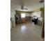 View of the kitchen featuring an appliance package, cabinets, and a window at 406 Driftwood E Dr, Palm Harbor, FL 34683