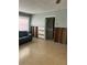 Another view of the living room showing the flooring and view to another room at 406 Driftwood E Dr, Palm Harbor, FL 34683