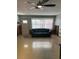 The living room includes a ceiling fan, a door to the outside, and a couch at 406 Driftwood E Dr, Palm Harbor, FL 34683