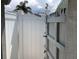 Enjoy the convenience of this outdoor shower surrounded by a white privacy fence at 406 Driftwood E Dr, Palm Harbor, FL 34683