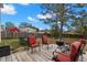 Landscaped backyard area with a patio, BBQ, and outdoor seating for entertainment at 4148 Landover Blvd, Spring Hill, FL 34609