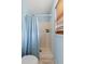 Functional bathroom with a shower, neutral tones, and a window for natural light providing a refreshing space at 4148 Landover Blvd, Spring Hill, FL 34609