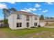 Charming two-story home with a well-maintained lawn, attached garage, and welcoming blue front door at 4148 Landover Blvd, Spring Hill, FL 34609