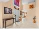 Bright foyer with tile floors, high ceilings, and decorative art, creating a welcoming entrance at 4148 Landover Blvd, Spring Hill, FL 34609