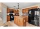 Modern kitchen with stainless steel appliances, granite countertops, and ample cabinet space at 4148 Landover Blvd, Spring Hill, FL 34609