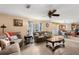 Inviting living room with hardwood-style floors and a cozy, open layout at 4148 Landover Blvd, Spring Hill, FL 34609