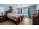 Main bedroom featuring natural light, wood-look flooring, and ample space for comfortable living at 4148 Landover Blvd, Spring Hill, FL 34609