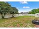 Spacious backyard with a partial fence, offering ample room for outdoor activities at 4190 Lema Dr, Spring Hill, FL 34609