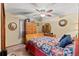 Bedroom with a ceiling fan, a window, and wood furniture at 4190 Lema Dr, Spring Hill, FL 34609