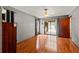 Bedroom with hardwood floors and access to the outdoor patio at 4190 Lema Dr, Spring Hill, FL 34609