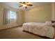 Simple bedroom featuring neutral carpeting and a comfortable twin bed at 4190 Lema Dr, Spring Hill, FL 34609