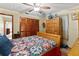 Cozy bedroom with a decorative quilt and a ceiling fan at 4190 Lema Dr, Spring Hill, FL 34609